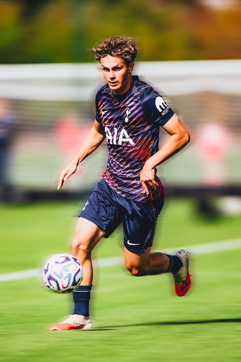 Tottenham player driving forward with the ball, motion blur edit