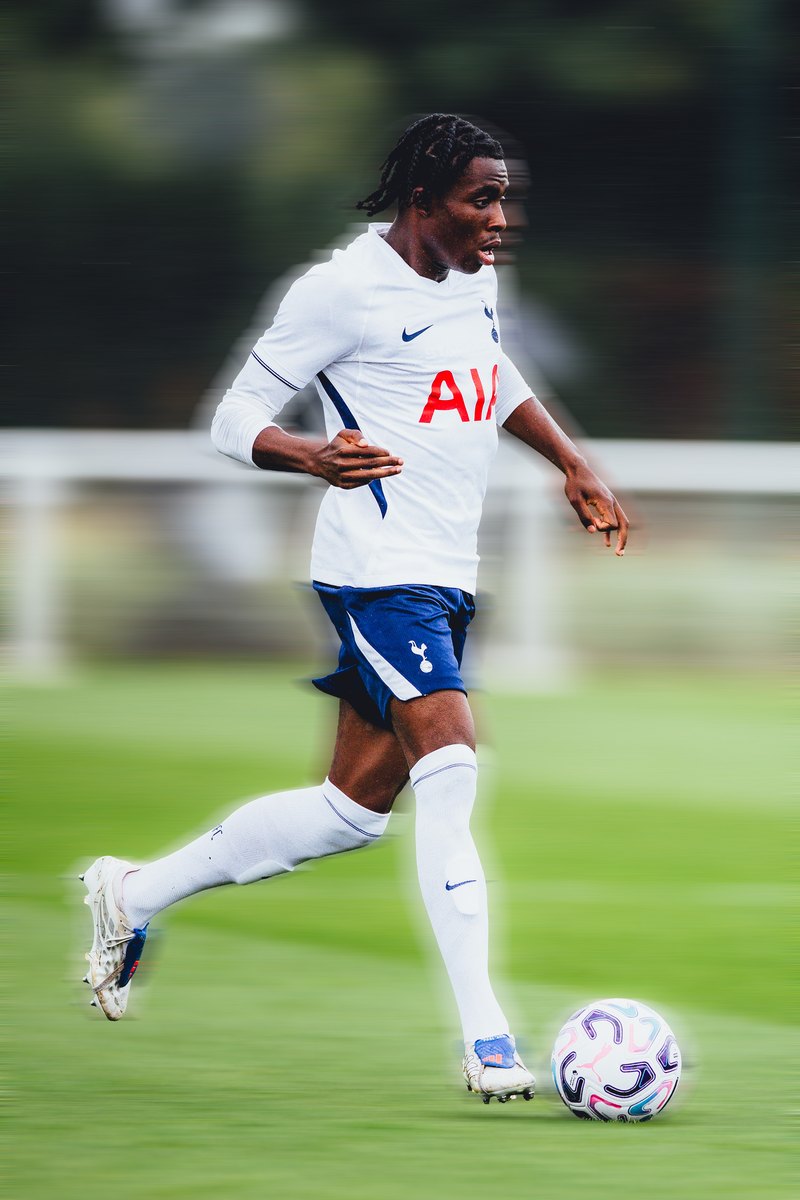 Tottenham player taking the ball forward, motion blur edit