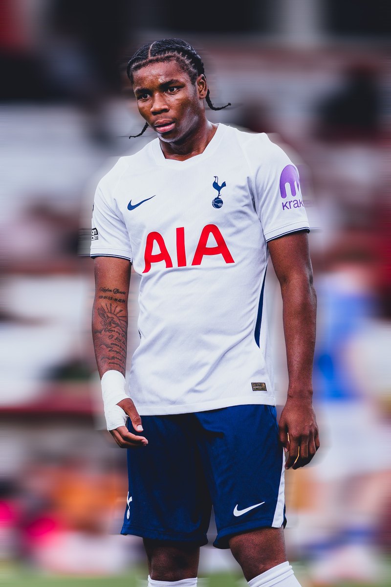 Tottenham player standing in front of the stands, motion blur edit